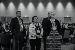 City of Mankato staff and elected officials watch their 2024 City of Excellence award video at the 2024 LMC Annual Conference