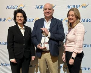 AGRiP President Barbara Zemlock, Greensweig, and AGRiP Vice President Suzanne Paulson pose for a photo after Greensweig received his AGRiP Leadership Award.
